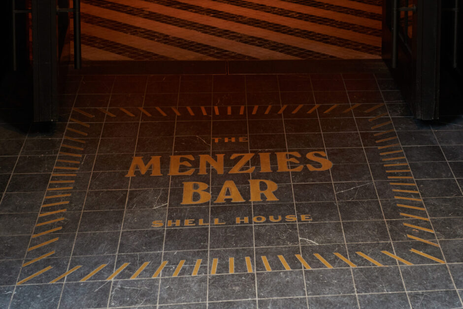 Detailed entrance of tiles and Menzies Bar Shell House signage on floor