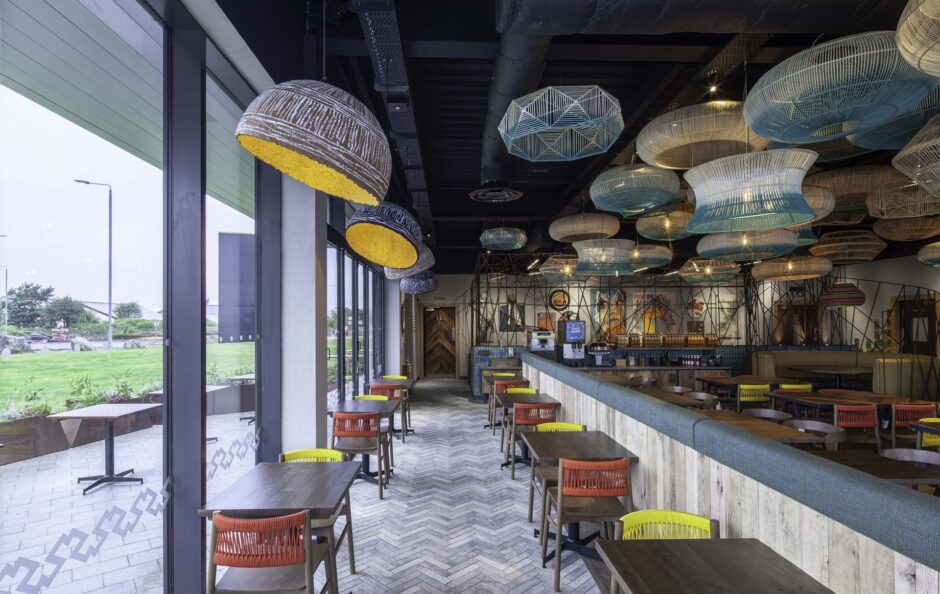 Captivating wall art and lighting fixtures at Nando's Paisley by Harrison