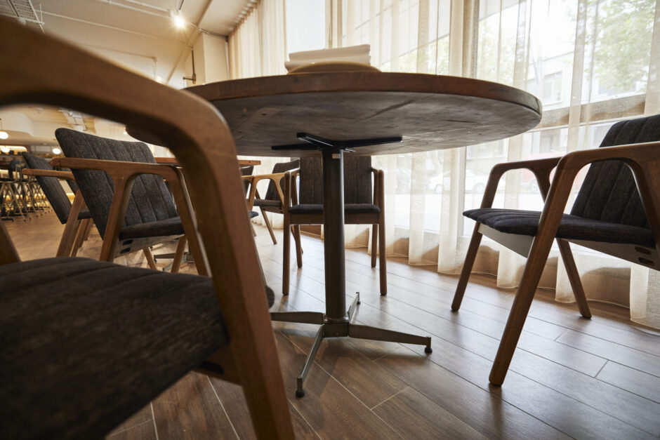 NOROCK's Parkway self-stabilising table bases in antique bronze at Petermen restaurant in Sydney