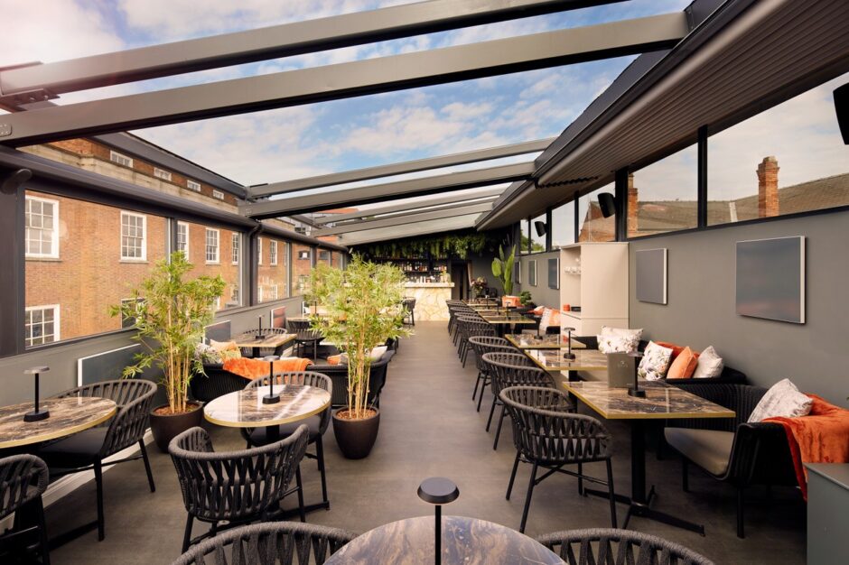 Cognito Lincoln UK with NOROCK Parkway self-stabilising table bases on their rooftop bar