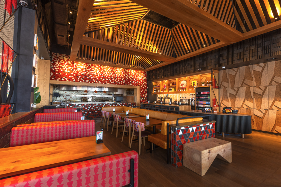 Nando's Post Oak featuring NOROCK Parkway self-stabilizing table bases to ensure no wobbly tables